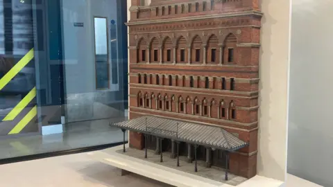 A model of the theatre royal, it has a flat front facade in red brick