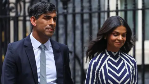 Reuters Rishi Sunak and his wife, Akshata Murty, leaving Downing Street