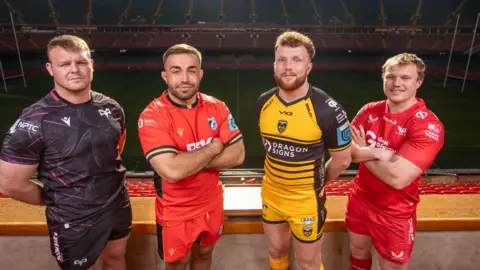 Dewi Lake, Liam Belcher, Aneurin Owen and Blair Murray promoting Judgement Day in April 2025