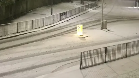 Snow on a road.