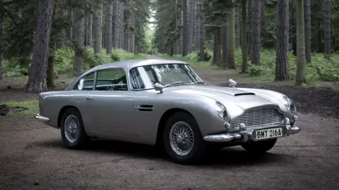 The Aston Martin DB5 in the forest setting of the famous Goldfinger car chase