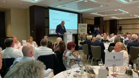 BBC Lyndon Farnham giving speech