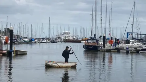 Brian Farmer/BBC Man in boat off Lymington quay