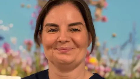 Leah smiles into camera