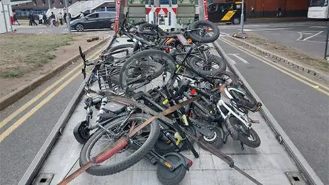 Derbyshire Police Illegal e-bikes and e-scooters that have been seized by Derbyshire Police on the back of a lorry in Derby.