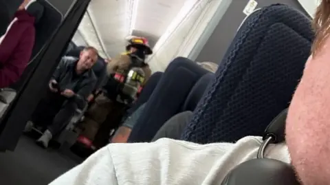 Ben Wodecki A firefighter in the aisle of a plane at Harry Reid International Airport in Las Vegas.