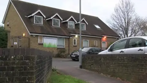 A general view of the Waterfield Practice in Bracknell, a two storey building with a sign saying 