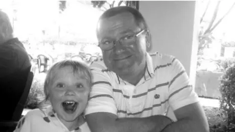 Family handout A black and white photo of Daisy when she was little with her dad