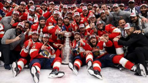 Florida Panthers players celebrate with the Stanley Cup
