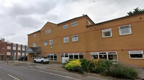 Streetview image of Falcon House, a three storey brick building sited on a road junction