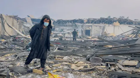 Reuters A man walks at the site of a drug users rehabilitation hospital destroyed in what the Taliban said was a Pakistani air strike in Kabul, Afghanistan, March 17, 2026.