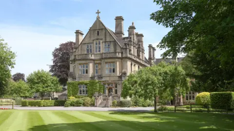 Warminster School A stately building with neatly trimmed grass in front