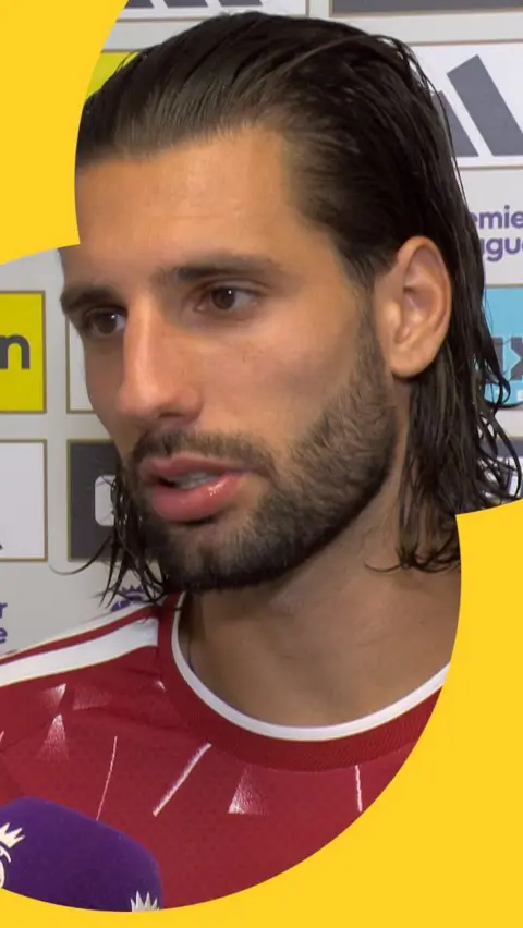 Dominik Szoboszlai speaks in the tunnel after Liverpool's draw at Newcastle