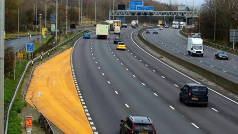 National Highways A yellow emergency area to the right of the picture alongside the four-lane M1 near Luton