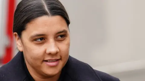 PA Media Samantha Kerr on her approach to court. She is wearing a dark winter coat and has her dark hair tied back