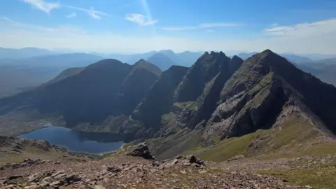 Colin Levey Rocky mountain pinnacles and a loch