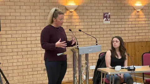 Simon Dedman/BBC Holly Fry speaking at the hearing