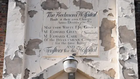 Damien Wootten An old sign above the door that declares the hospital was built by the keelmen