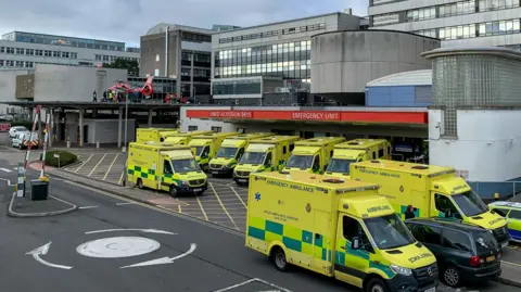 Getty Images Ambulances are parked outside an accident and emergency centre as part of a large hospital complex.