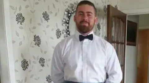 Kevin McCauley Close up of Frazer Irvine in a shirt and bow tie