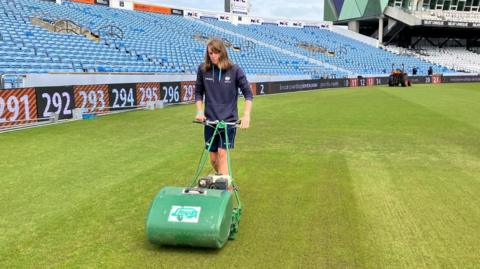 Jasmine Nicholls mowing the pitch at headingley