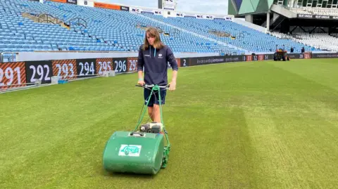 BBC / Elizabeth Baines Jasmine Nicholls mowing the pitch at headingley