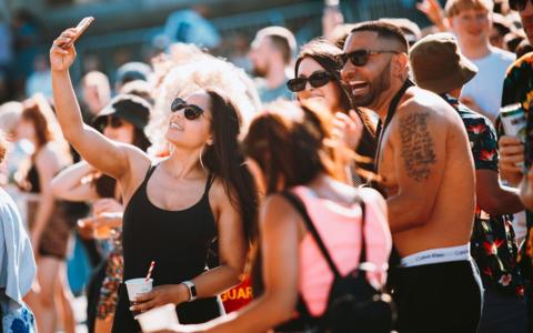 Fans take selfies during the Annie Mac concert at Bristol Sounds 2024