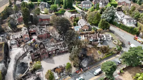 EPA/Shutterstock An aerial image taken with a drone of fire damaged properties in Stourbridge, showing burned out homes.