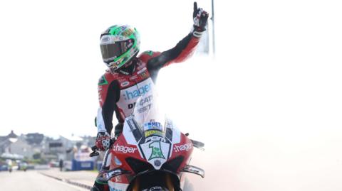 Glenn Irwin celebrates his third Superbike victory at the North West 200