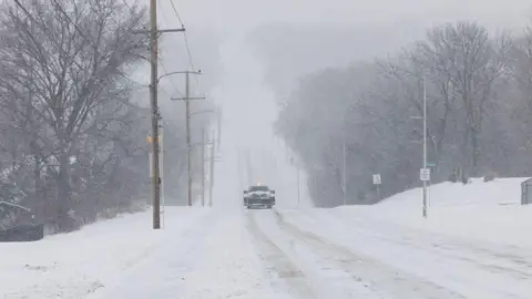 Getty Images A snow-covered road in Kansas. 