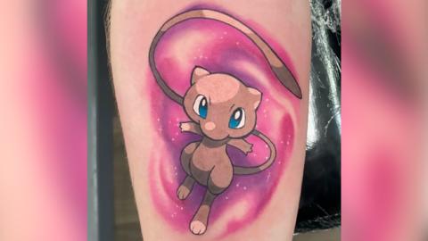 A tattoo of the character Mew from Pokémon 