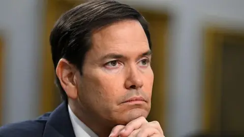 Secretary of State Marco Rubio pictured taking questions during a Senate hearing
