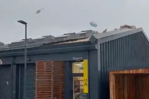 Roof tiles blow off a one storey office building in Skye 