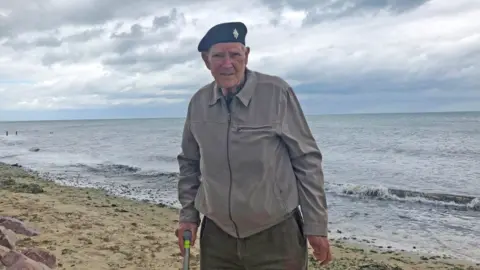 PA Media Albert Price on the beach in Normandy in 2019