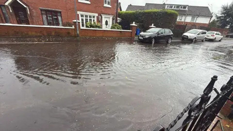 Paul Doherty A residential street flooded.