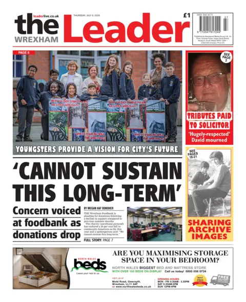 The Wrexham Leader Front page of the Wrexham Leader. Main headline reads: 'Cannot sustain this long term'; Concern voiced at foodbank as donations drop. Other headline: Youngsters provide a vision for city's future, and tributes paid to solicitor. And under that is a black and white image of two people that reads sharing archive images. 