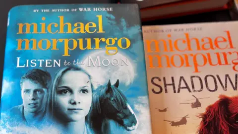 Two hardback books by the author Michael Morpurgo.