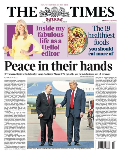 The headline on the front page of the Times reads: "Peace in their hands".