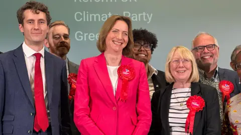 Ian Wyatt/BBC Pam Cox smiling after being elected