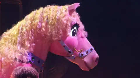 A pink pony on stage at the Grammy Awards