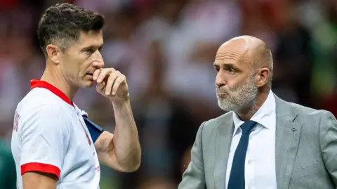Poland striker Robert Lewandowski and Michal Probierz