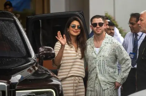 Getty Images Actress Priyanka Chopra and her husband singer Nick Jonas arrive in Mumbai to attend wedding of Anant Ambani and Radhika Merchant on July 11, 2024 in Mumbai