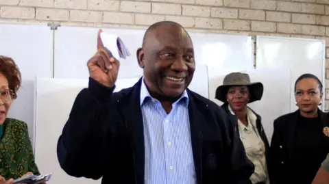 Reuters South African president Cyril Ramaphosa casts his vote during the South African elections