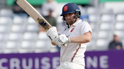 Essex batsman Matt Critchley in action, pulling a shot into the on-side.