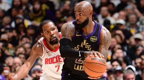 Kevin Durant of the Houston Rockets guards LeBron James of the Los Angeles Lakers during game two of their 2026 NBA play-off series