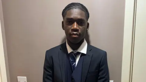 Marcus Fakana in school uniform