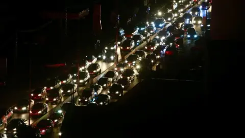 EPA Lebanese people in the south of the country flee with their cars towards Sidon and Beirut