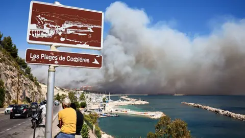 Smoke rises on the horizon 