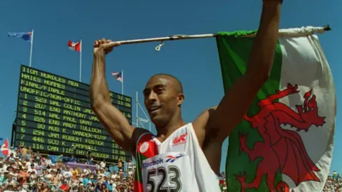 Colin Jackson celebrates after winning Gold in the mens 110m hurdles final at the 1994 Commonwealth Games in Victoria.