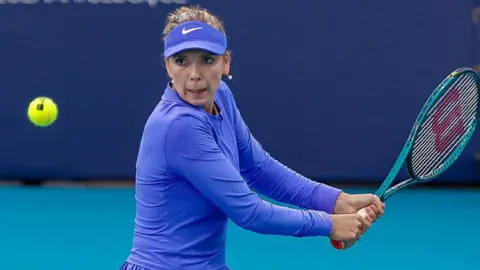 Katie Boulter takes a shot